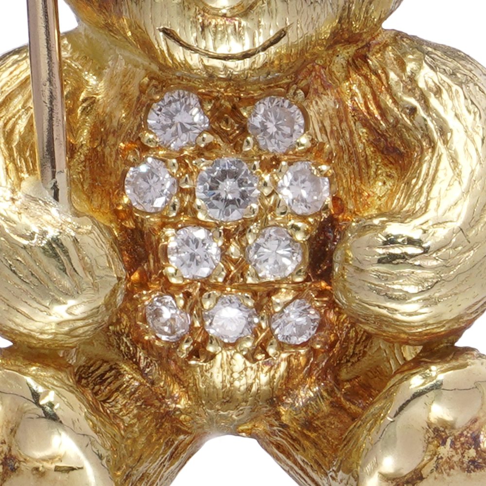 Gold bear brooch with pearl balloon, diamonds and sapphires.