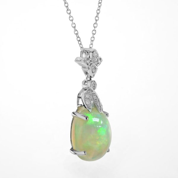 3.62ct Oval Opal and Diamond Pendant Necklace, 3.62 carat oval cabochon Australian opal with play-of-colour suspended from diamond fleur-de-lis top in 18ct white gold