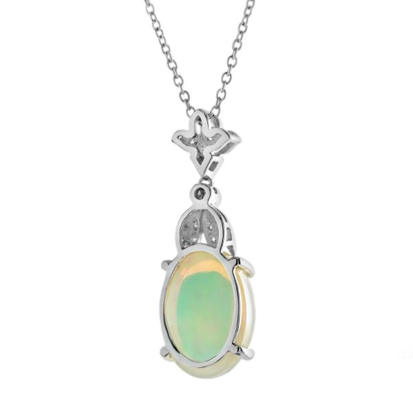 3.62ct Oval Opal and Diamond Pendant Necklace, 3.62 carat oval cabochon Australian opal with play-of-colour suspended from diamond fleur-de-lis top in 18ct white gold