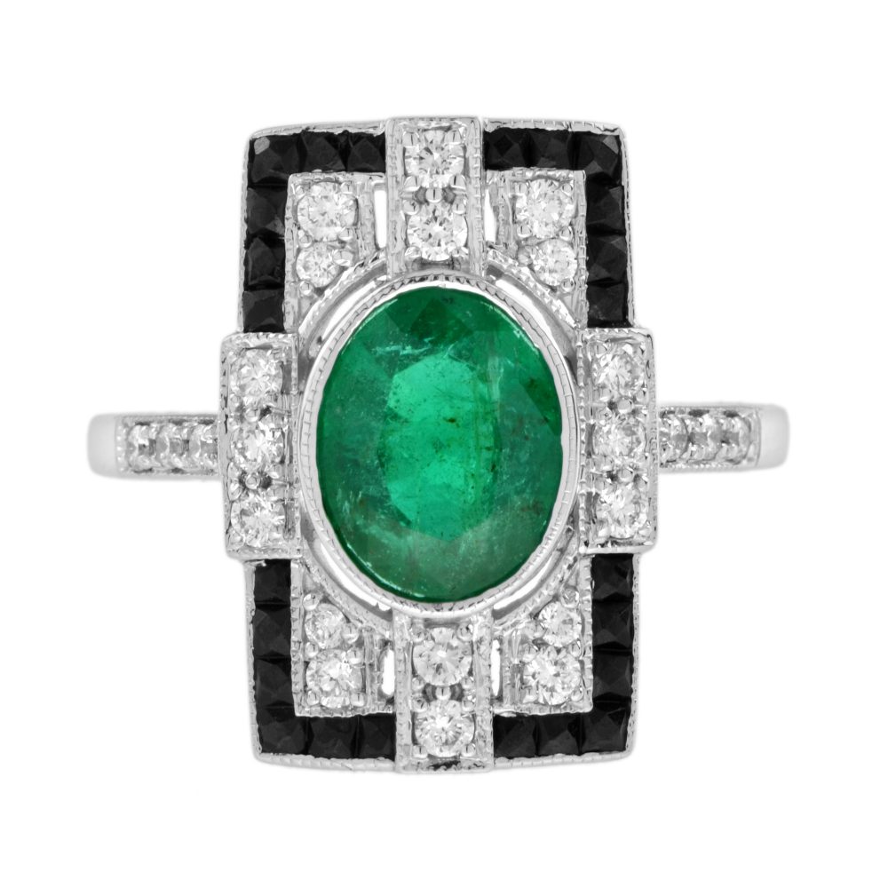 1.80ct. Emerald Diamond and Black Onyx Cluster Plaque Ring, 1.80ct oval vivid green emerald surrounded by sparkling diamonds framed with a sleek black onyx border in 18ct white gold
