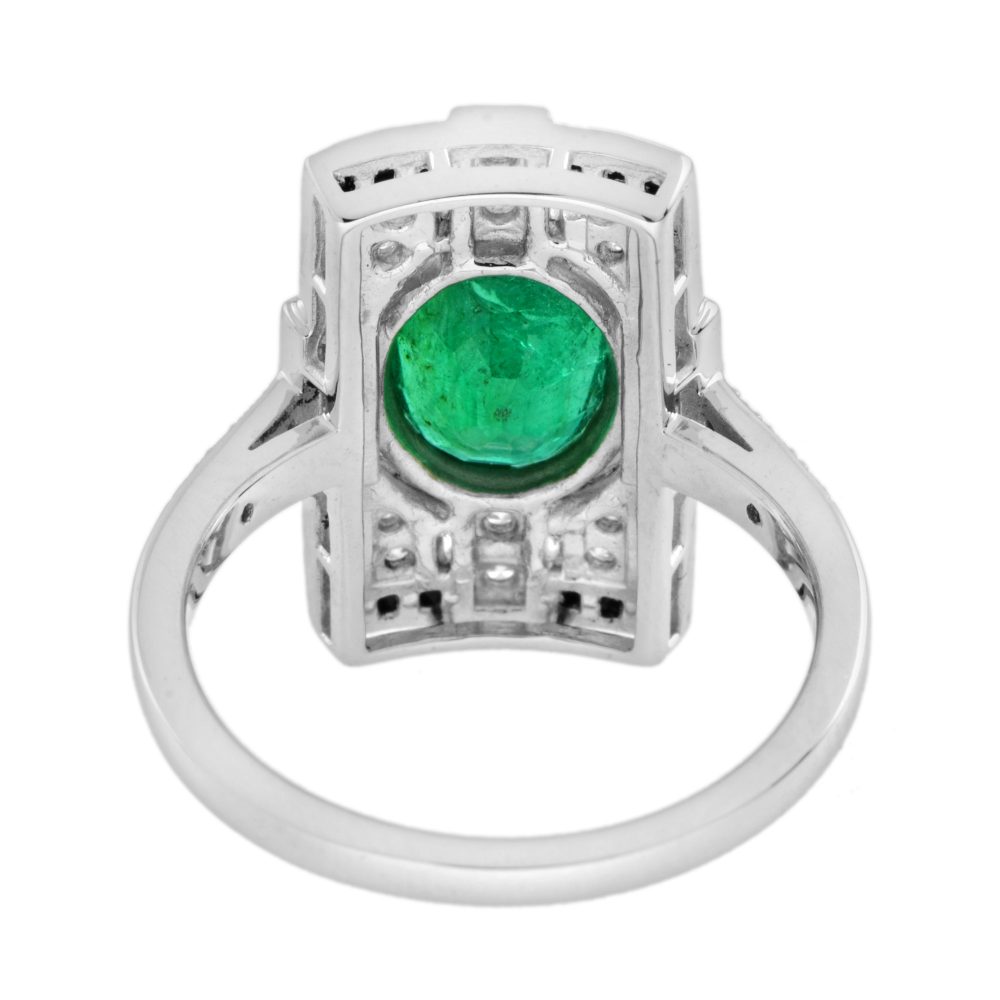 1.80ct. Emerald Diamond and Black Onyx Cluster Plaque Ring, 1.80ct oval vivid green emerald surrounded by sparkling diamonds framed with a sleek black onyx border in 18ct white gold