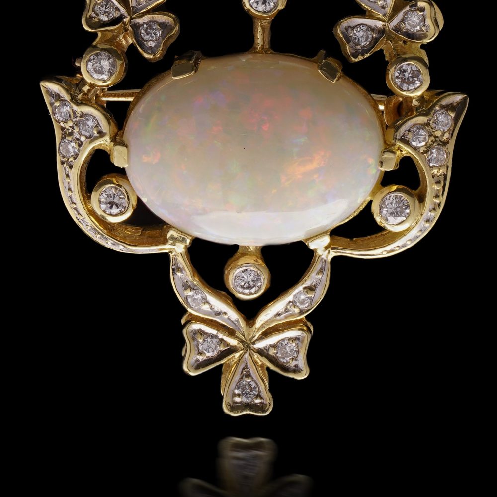 Vintage opal and diamond pendant/brooch in gold.