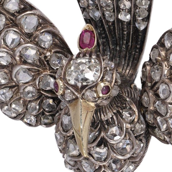 Victoria diamond bird brooch in gold and silver.