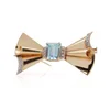 Vintage aquamarine and diamond bow brooch in gold and platinum.