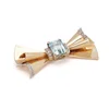 Vintage aquamarine and diamond bow brooch in gold and platinum.