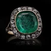Antique emerald and diamond ring in gold.