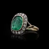 Antique emerald and diamond ring in gold.