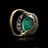Antique emerald and diamond ring in gold.