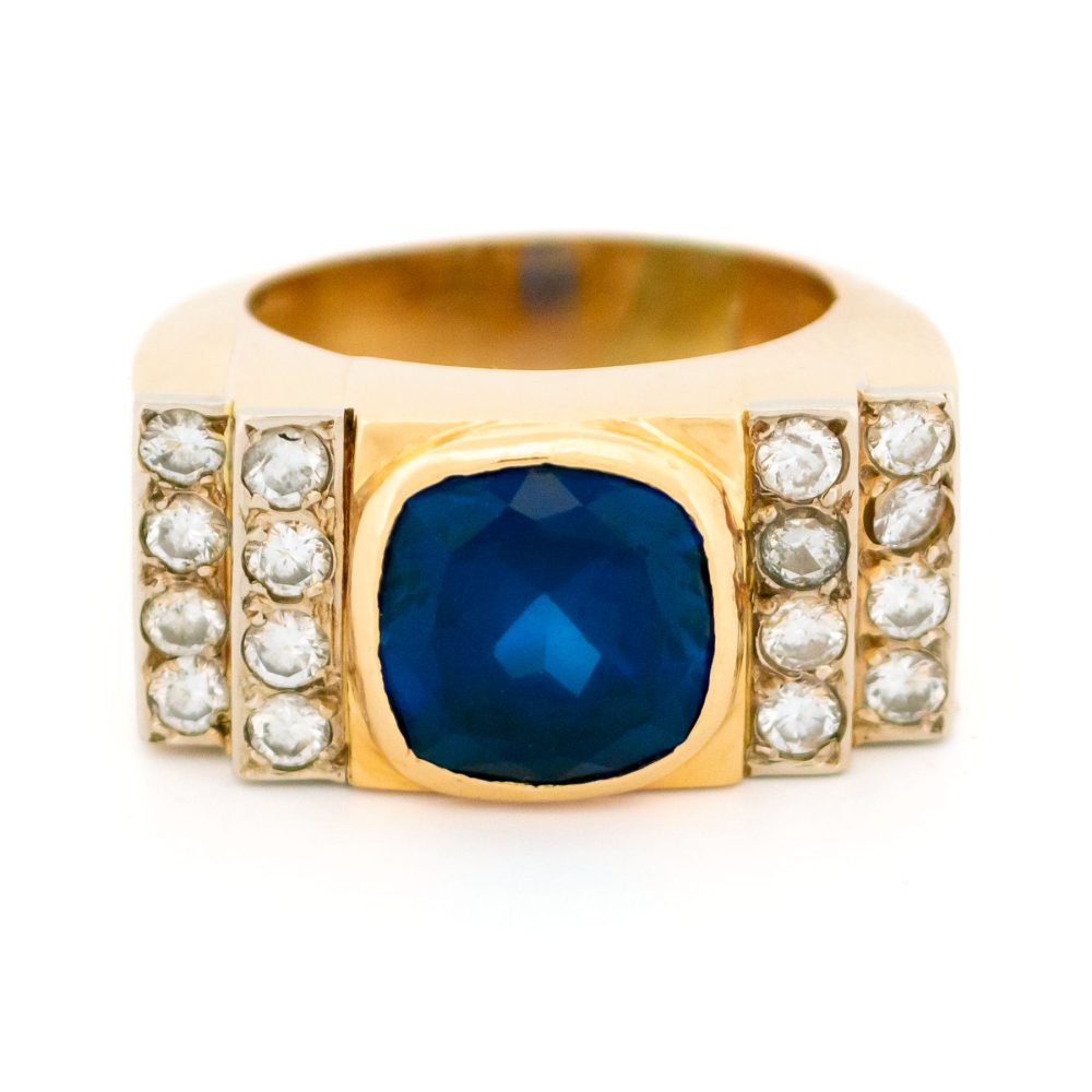 Vintage Retro Verneuil Sapphire and Diamond Set 18ct Yellow Gold Tank Ring, 6.22ct Verneuil synthetic sapphire complemented by 16 round brilliant-cut diamond accents