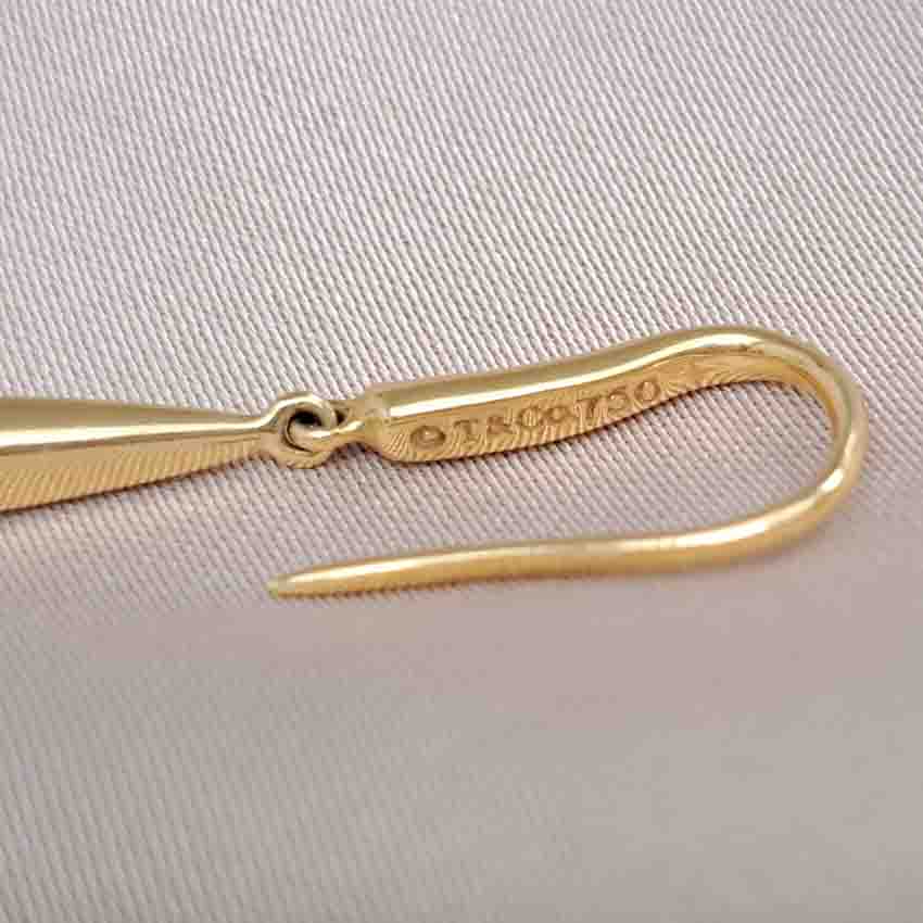 Tiffany and Co Yellow Gold Feather Earrings, 18ct yellow gold drop earrings from Tiffany & Co Feather Collection. Circa 2000-2009