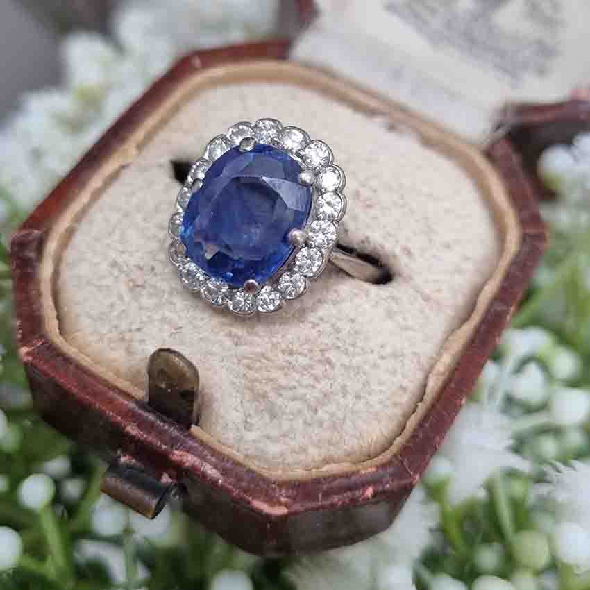Vintage Antique Art Deco Natural No Heat 4.30ct Oval Cushion Cut Sapphire and Old Cut Diamond Cluster Engagement Ring in Platinum and 18ct Gold, Circa 1920s