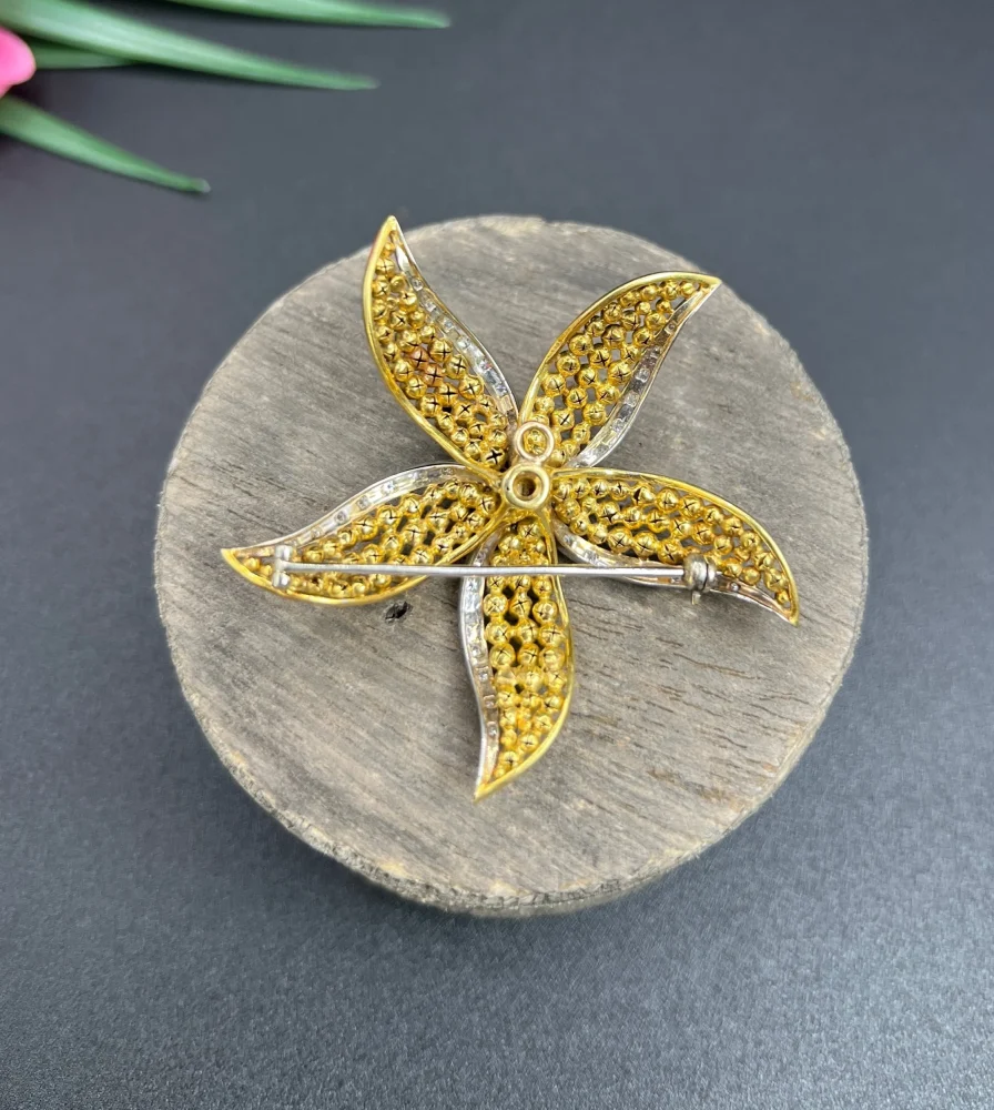 Vintage Diamond Ruby Gold and Platinum Flower Brooch come Pendant, diamond and ruby cluster leads to 18ct yellow gold textured striking petals accented with platinum edges. Circa 1970s