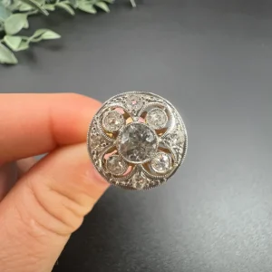 Edwardian Antique Diamond Circular Compass Points Cluster Engagement Ring, 0.60ct diamond surrounded by four diamond points within diamond halo frame in platinum to 18ct yellow gold. Circa 1910