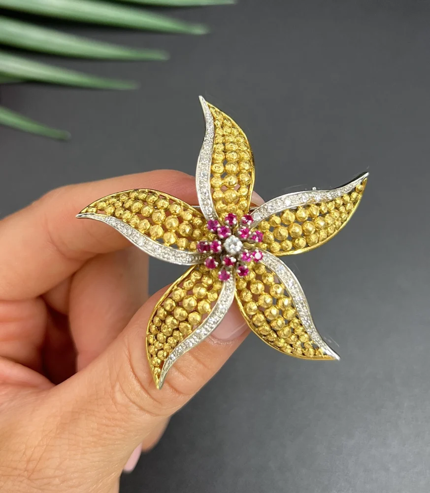 Vintage Diamond Ruby Gold and Platinum Flower Brooch come Pendant, diamond and ruby cluster leads to 18ct yellow gold textured striking petals accented with platinum edges. Circa 1970s