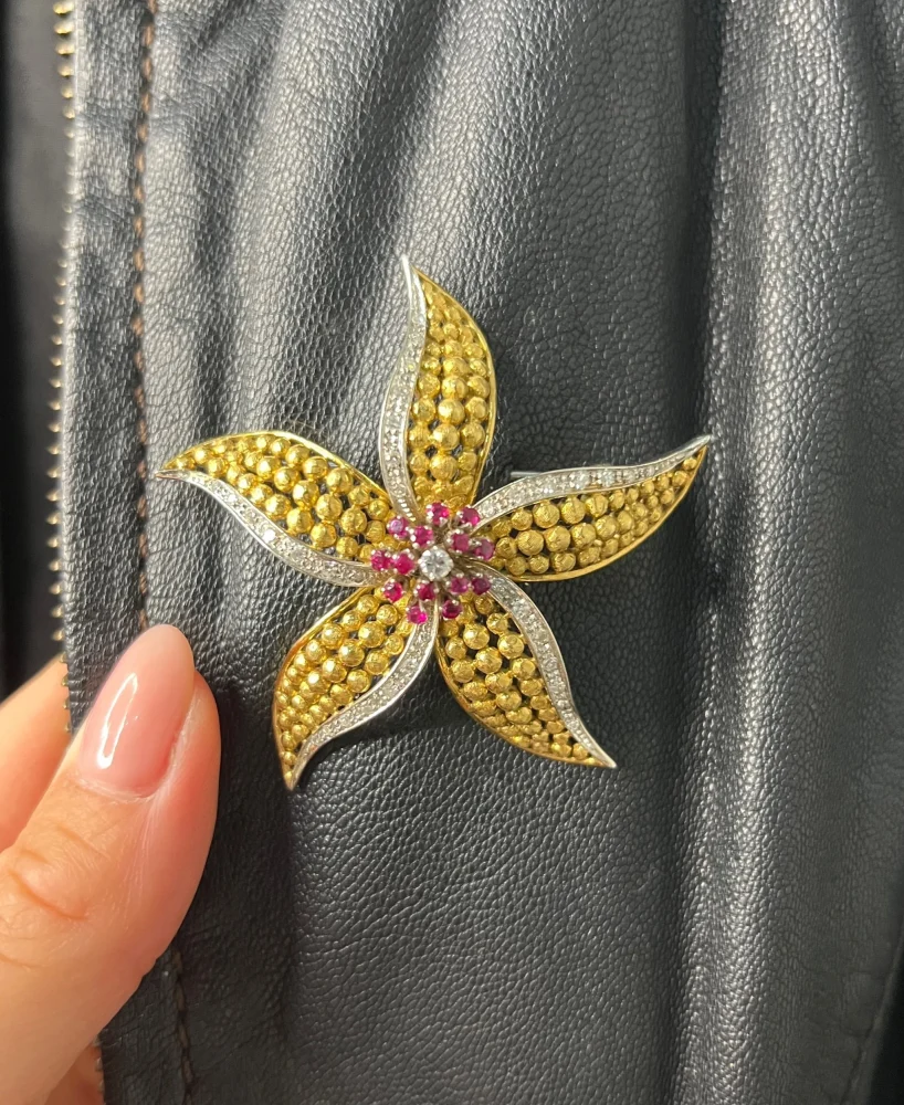Vintage Diamond Ruby Gold and Platinum Flower Brooch come Pendant, diamond and ruby cluster leads to 18ct yellow gold textured striking petals accented with platinum edges. Circa 1970s