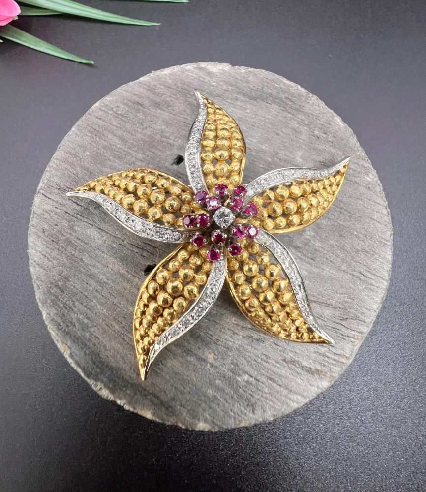 Vintage Diamond Ruby Gold and Platinum Flower Brooch come Pendant, diamond and ruby cluster leads to 18ct yellow gold textured striking petals accented with platinum edges. Circa 1970s