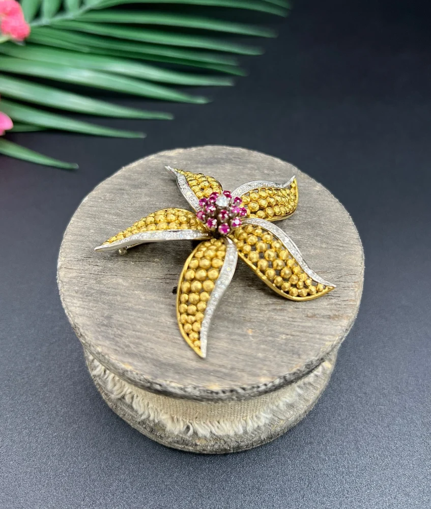 Vintage Diamond Ruby Gold and Platinum Flower Brooch come Pendant, diamond and ruby cluster leads to 18ct yellow gold textured striking petals accented with platinum edges. Circa 1970s