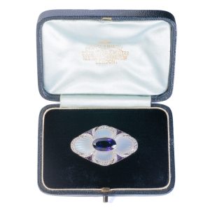 Edwardian Antique Amethyst and Moonstone Flower Brooch, oval purple amethyst sits centre to carved moonstone petals framed by rose diamonds and calibre cut amethysts