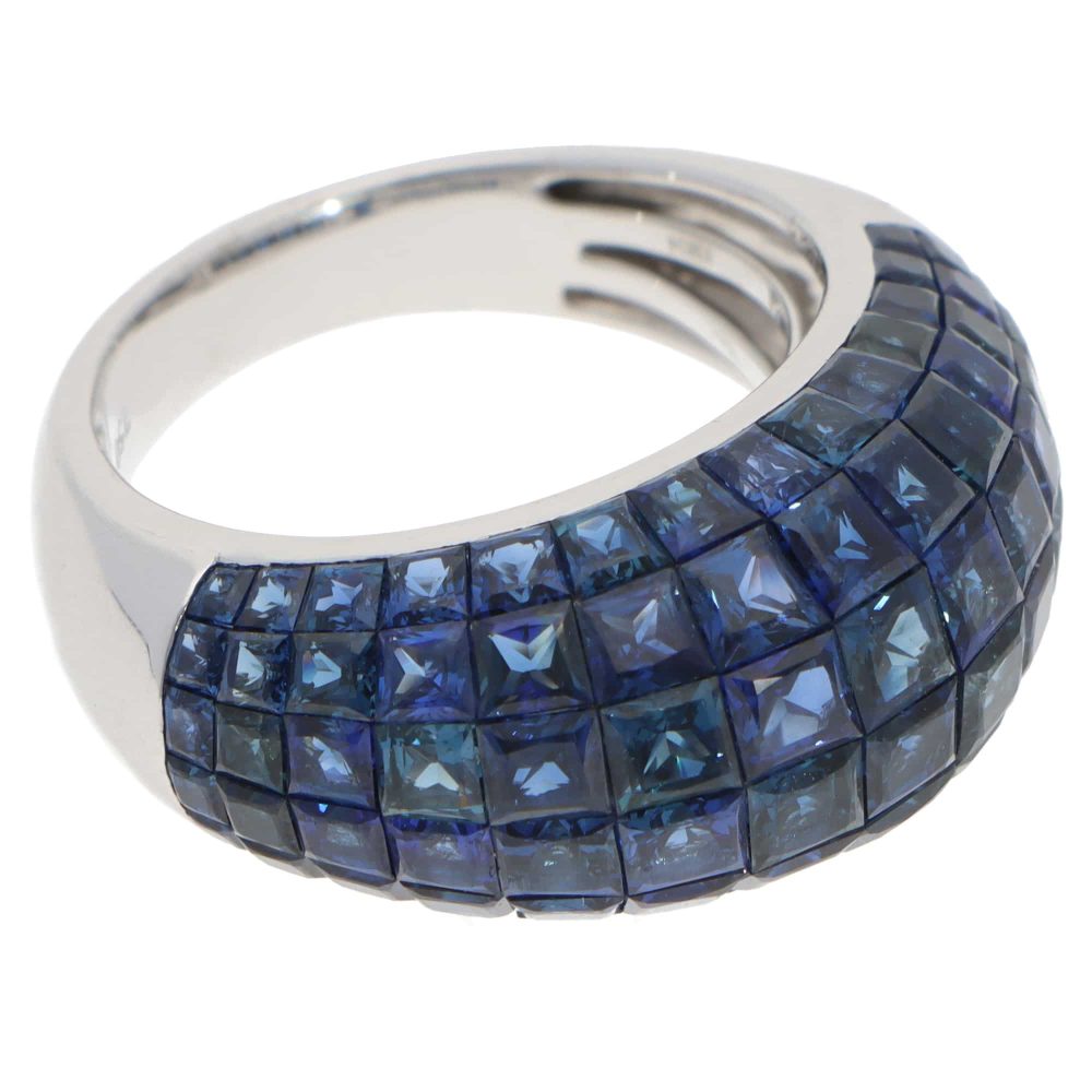 Contemporary 16.69ct Sapphire Bombe Cocktail Ring in 18ct White Gold, six rows of graduated-sized French-cut sapphires securely invisible-set