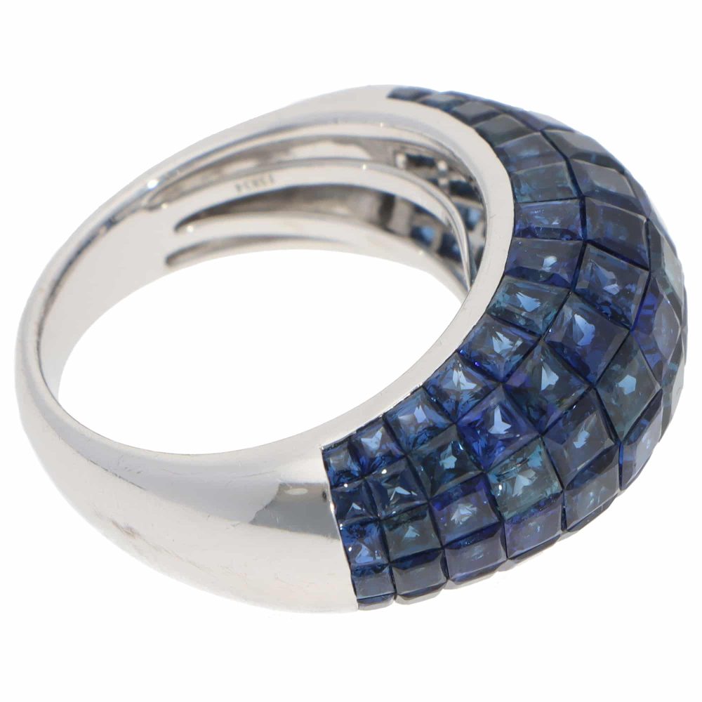 Contemporary 16.69ct Sapphire Bombe Cocktail Ring in 18ct White Gold, six rows of graduated-sized French-cut sapphires securely invisible-set