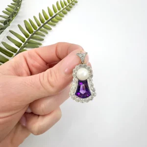 Edwardian amethyst, diamond and pearl pendant in gold and platinum.