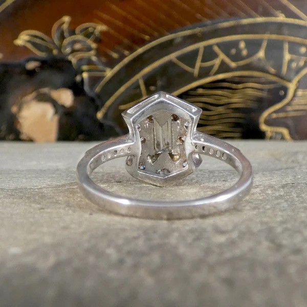 Baguette Diamond Cluster Plaque Tablet Ring, 0.40ct baguette-cut diamond surrounded by shield-shaped cluster of 0.60cts brilliant cut diamonds in 18ct white gold