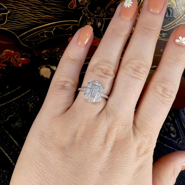 Baguette Diamond Cluster Plaque Tablet Ring, 0.40ct baguette-cut diamond surrounded by shield-shaped cluster of 0.60cts brilliant cut diamonds in 18ct white gold