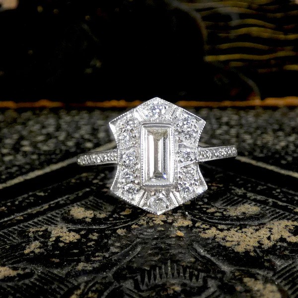 Baguette Diamond Cluster Plaque Tablet Ring, 0.40ct baguette-cut diamond surrounded by shield-shaped cluster of 0.60cts brilliant cut diamonds in 18ct white gold