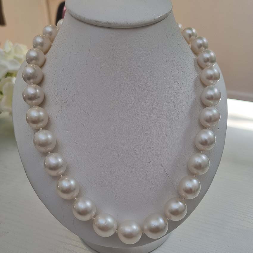 South Sea Pearl Necklace with Diamond Clasp, striking pearl necklace composed of South Sea pearls secured with a diamond set ball/bead shaped clasp