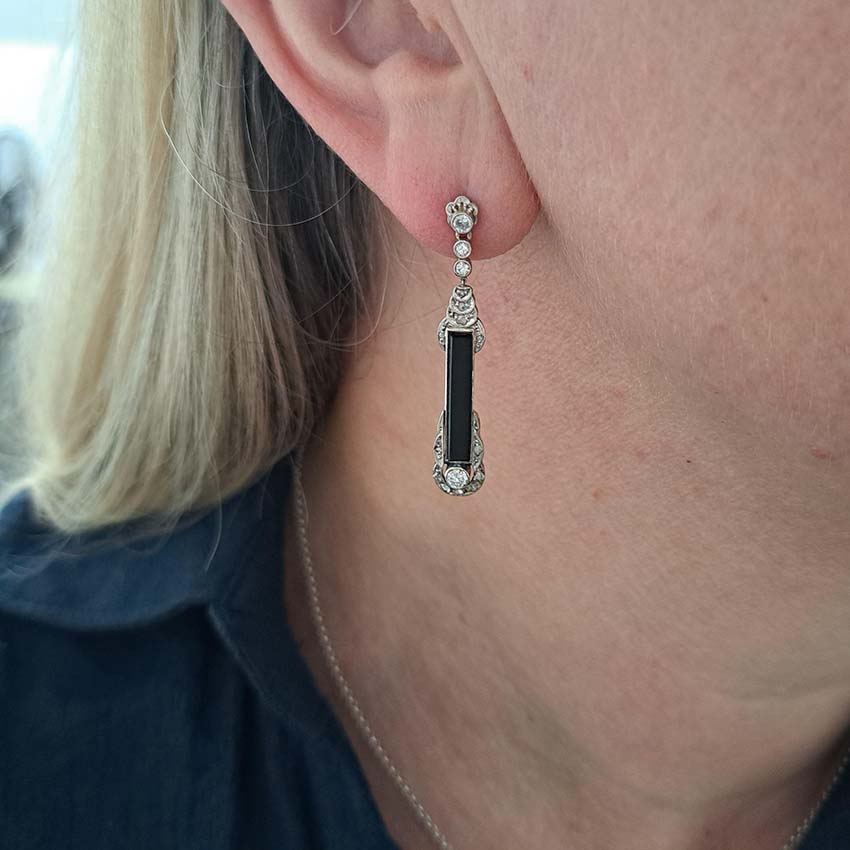 Art Deco Onyx and Diamond Drop Earrings, Elongated strong black onyx framed by rose-cut diamonds accented with further sparkling diamonds in 14ct white gold. Circa 1920s