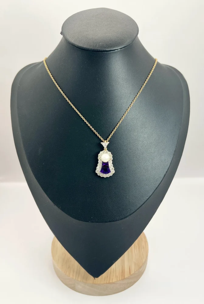 Edwardian amethyst, diamond and pearl pendant in gold and platinum.