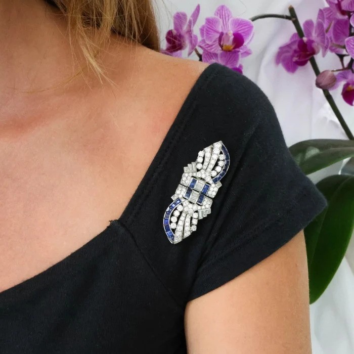 Art Deco Tiffany and Co Sapphire Diamond and Platinum Double Clip Brooch, Round brilliant-cut and baguette-cut diamonds accented by square-cut sapphires, Circa 1930