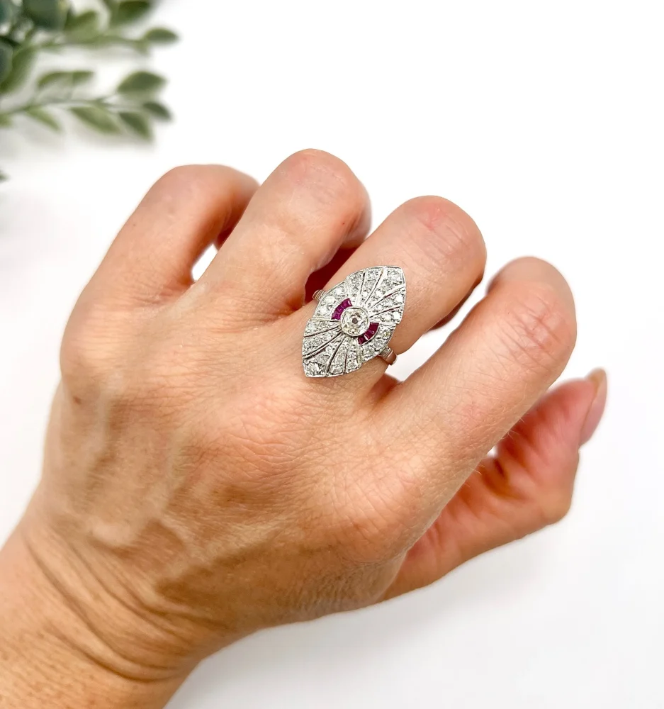 Vintage Diamond and Ruby Cluster Marquise Navette Shaped Ring, 3.5mm diamond sits prominent within diamond surround with rich red ruby accents in platinum. Circa 2000