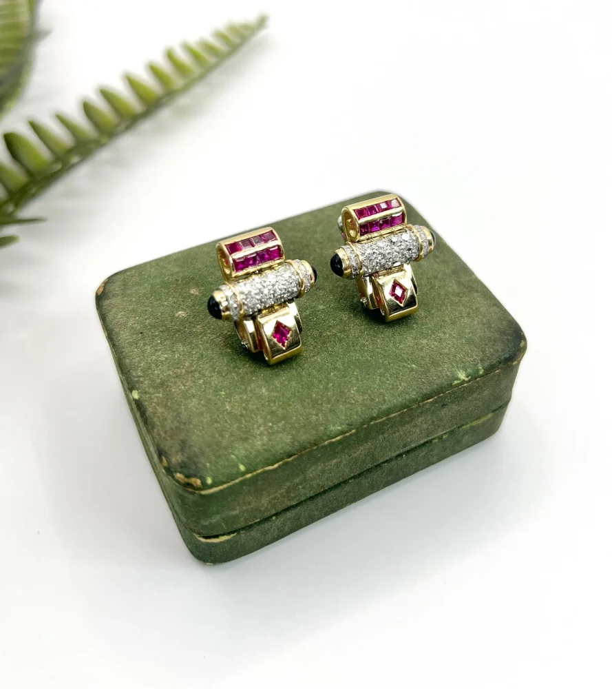 Art Deco diamond, ruby and onyx earrings in yellow and white gold.