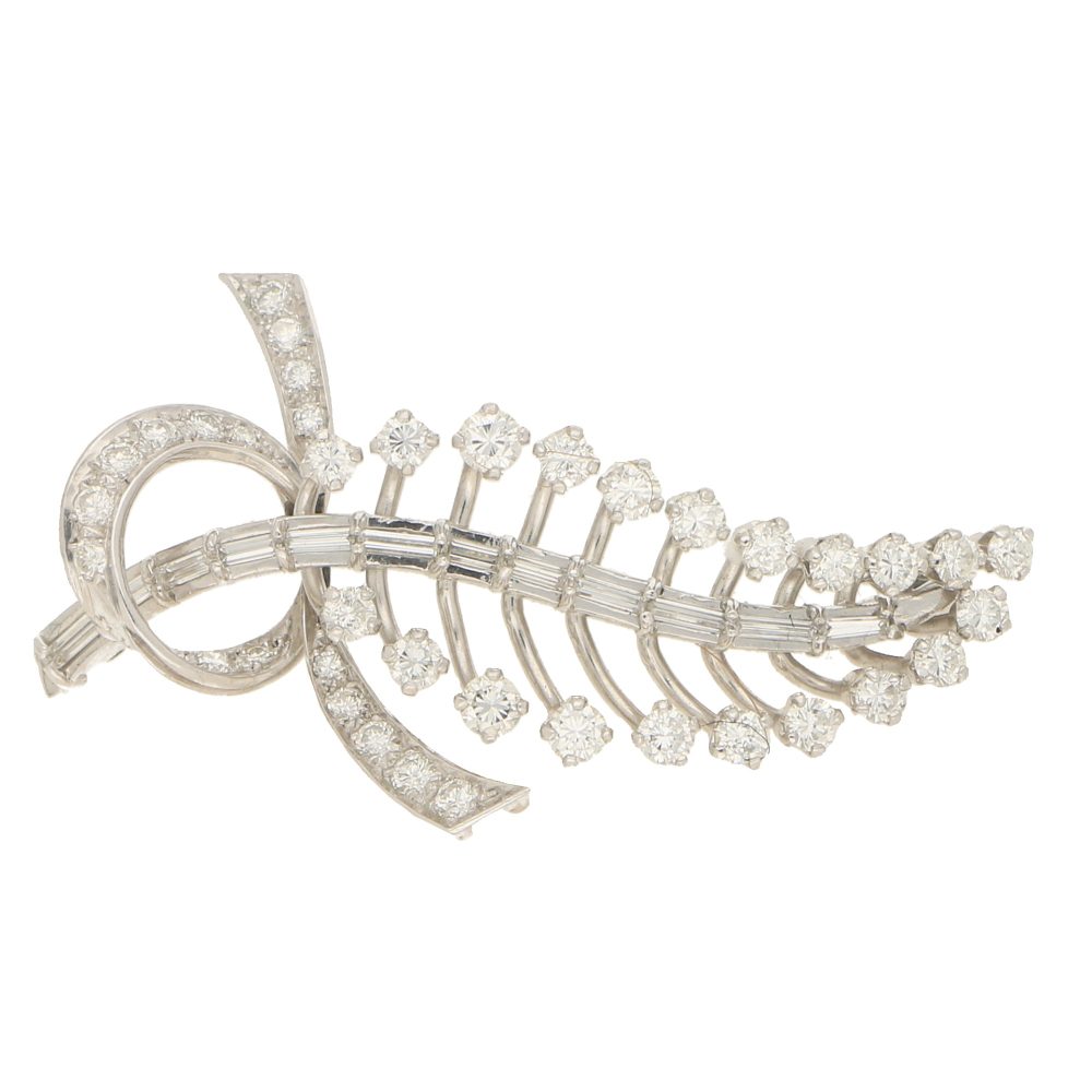 Diamond feather brooch in white gold.