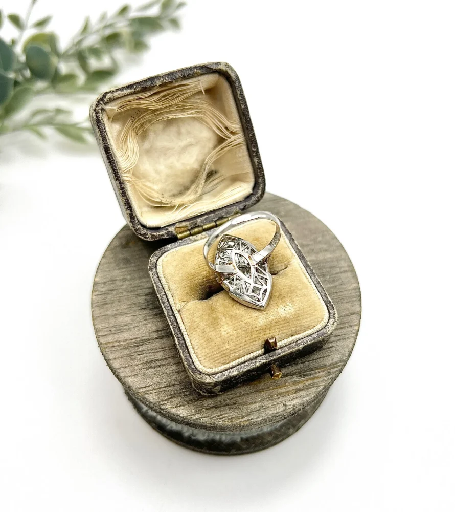 Vintage Diamond and Ruby Cluster Marquise Navette Shaped Ring, 3.5mm diamond sits prominent within diamond surround with rich red ruby accents in platinum. Circa 2000