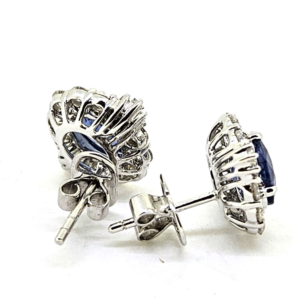 1.97ct Oval Sapphire and Diamond Cluster Stud Earrings, oval blue sapphires surrounded by brilliant-cut diamonds with tapered baguette diamonds to the sides in 18ct white gold