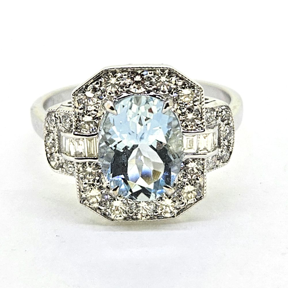 1.62ct Oval Aquamarine and Diamond Cluster Ring with Brilliant and Baguette Diamond Buckle Shoulders in 18ct White Gold