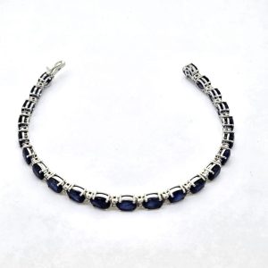 Oval Sapphire and Diamond Line Bracelet, 23.01 carats oval blue sapphires alternated with sparkling diamonds in 18ct white gold