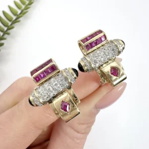 Art Deco diamond, ruby and onyx earrings in yellow and white gold.