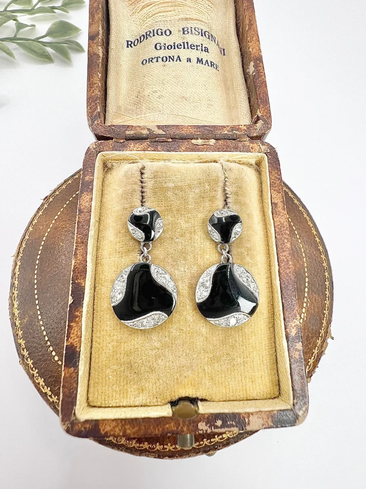 Art Deco diamond and onyx earrings in white gold.