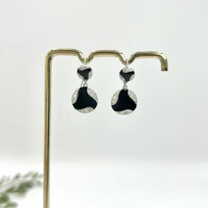 Art Deco diamond and onyx earrings in white gold.