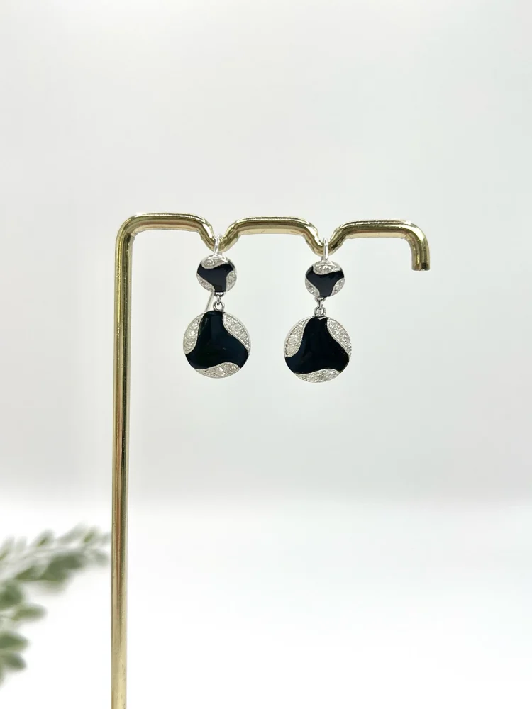 Art Deco diamond and onyx earrings in white gold.