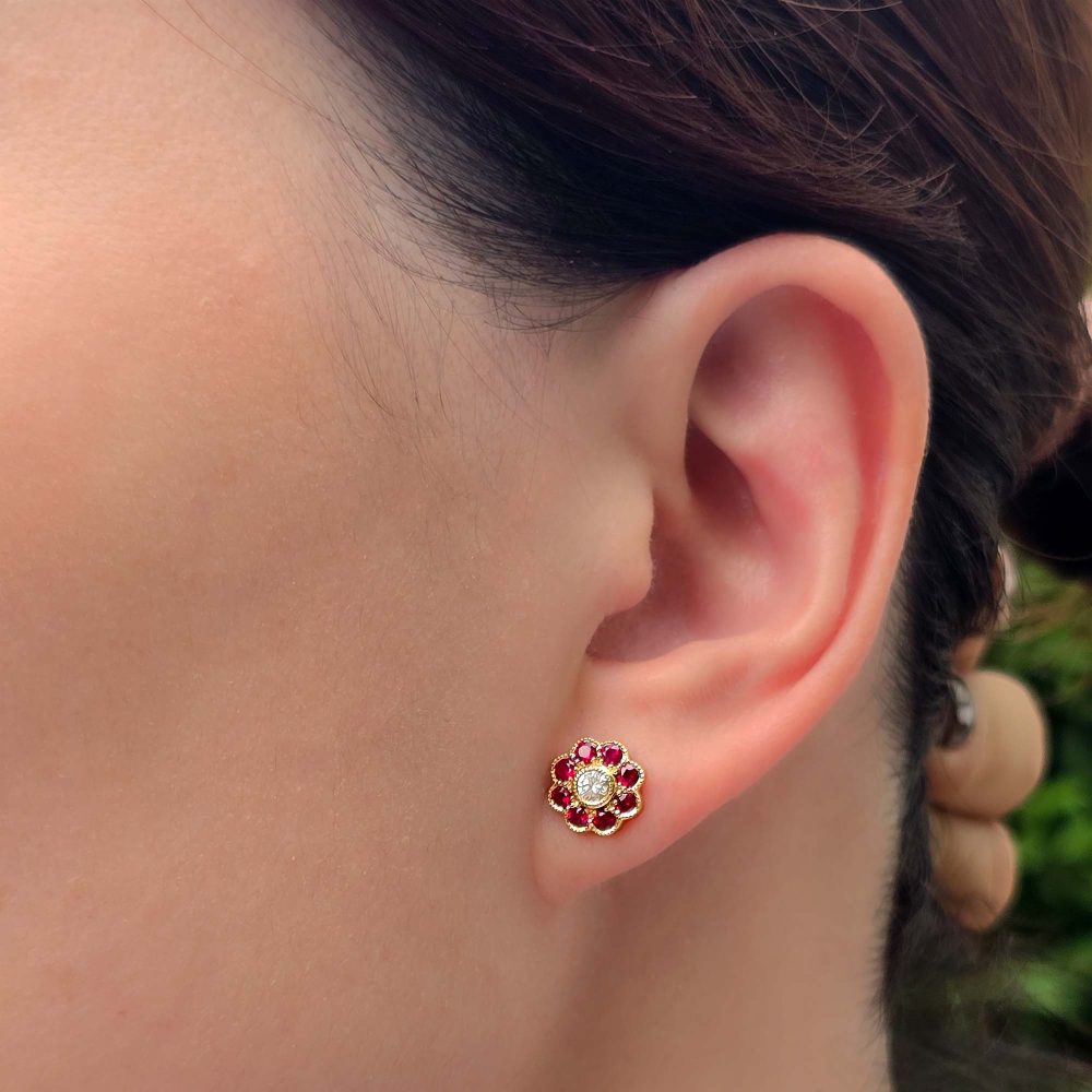 Modern Diamond and Ruby Floral Cluster Stud Earrings in 14ct Yellow Gold, central diamonds surrounded by vibrant red rubies in timeless flower design