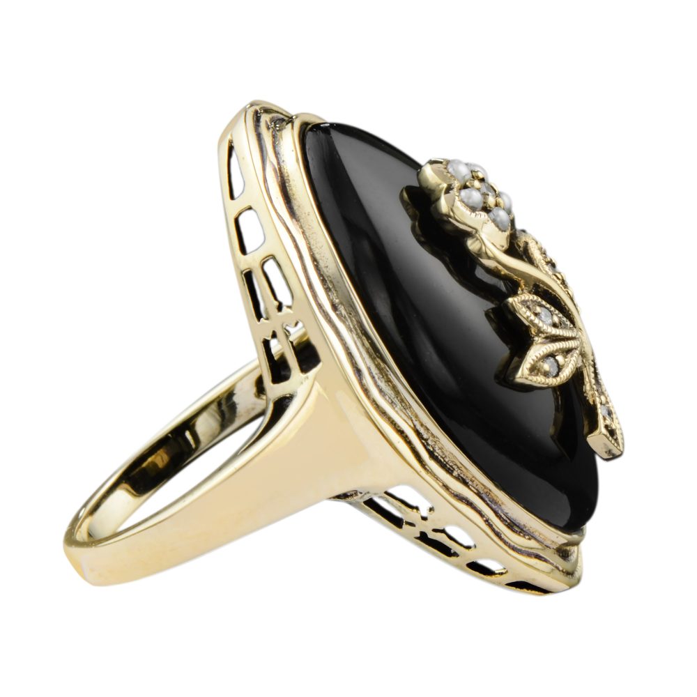 Black Onyx Navette Plaque Ring with Diamond and Pearl Flower in 14ct Yellow Gold, marquise-shaped onyx tablet with diamond and pearl floral and leaf motif