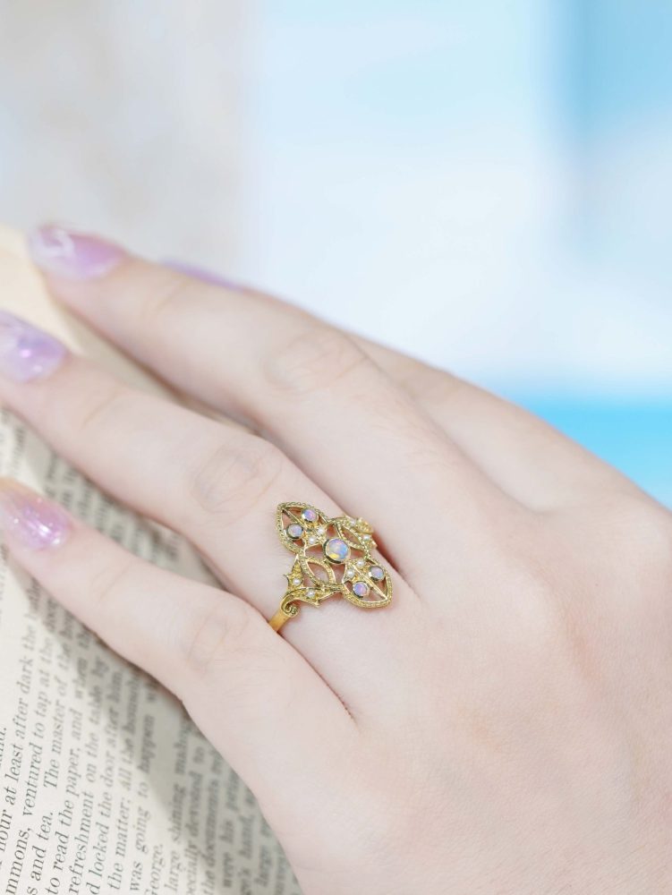 Opal and Pearl Set Openwork Navette Ring, 9ct yellow gold floral openwork ring set with opals and pearls with intricate filigree work on the shoulders
