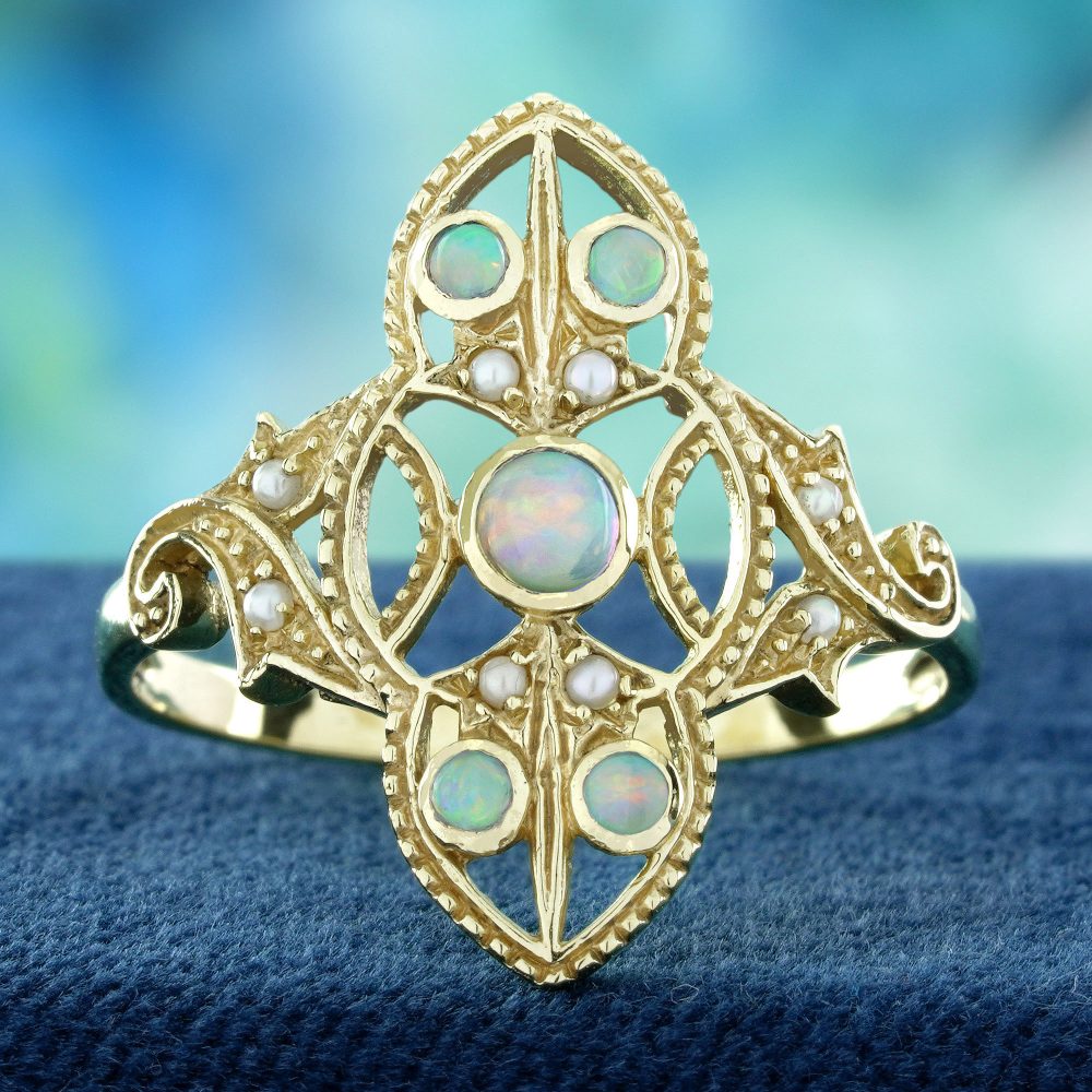 Opal and Pearl Set Openwork Navette Ring, 9ct yellow gold floral openwork ring set with opals and pearls with intricate filigree work on the shoulders