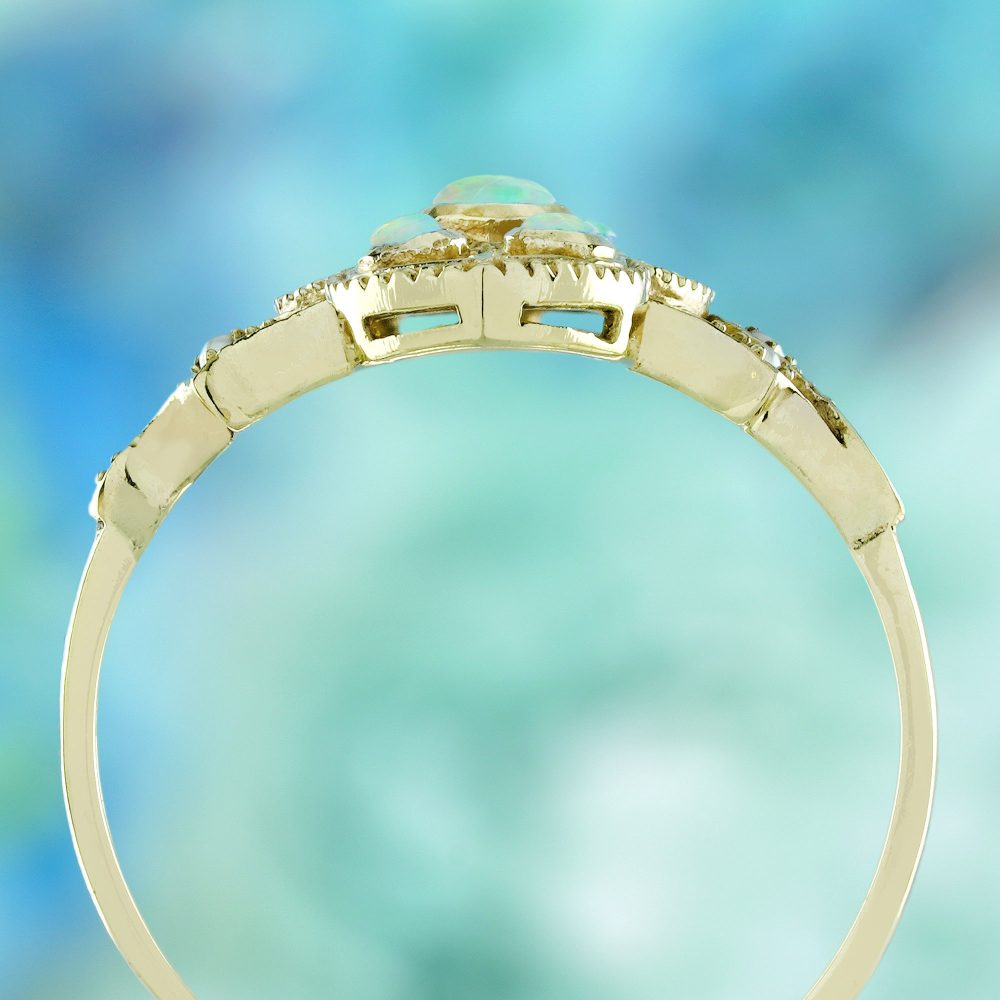 Opal and Pearl Set Openwork Navette Ring, 9ct yellow gold floral openwork ring set with opals and pearls with intricate filigree work on the shoulders