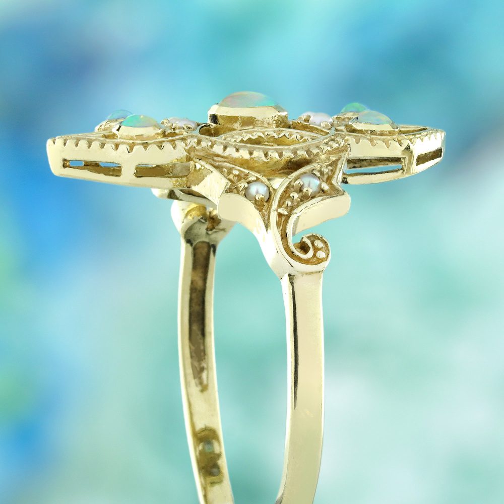 Opal and Pearl Set Openwork Navette Ring, 9ct yellow gold floral openwork ring set with opals and pearls with intricate filigree work on the shoulders