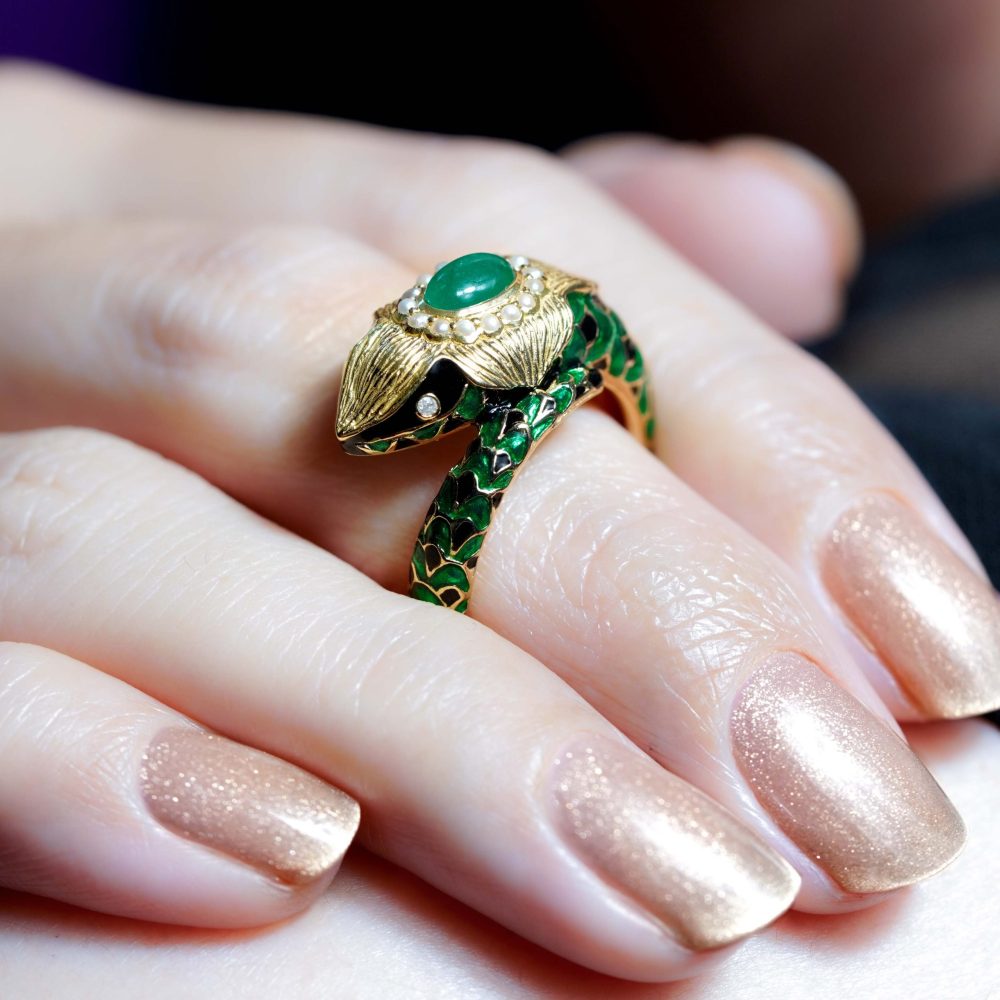 Green Black Enamel Snake Ring with Cabochon Emerald and Pearls, cabochon emerald surrounded by pearls with intricate enamel work and diamond eyes in 9ct yellow gold